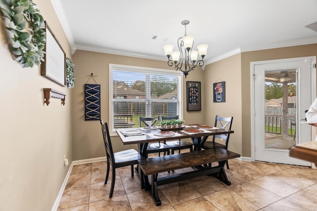 tiled dining area featuring a healthy amount of sunlight, ornamental molding, and an inviting chandelier