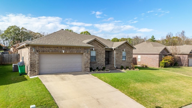 single story home with a garage and a front lawn