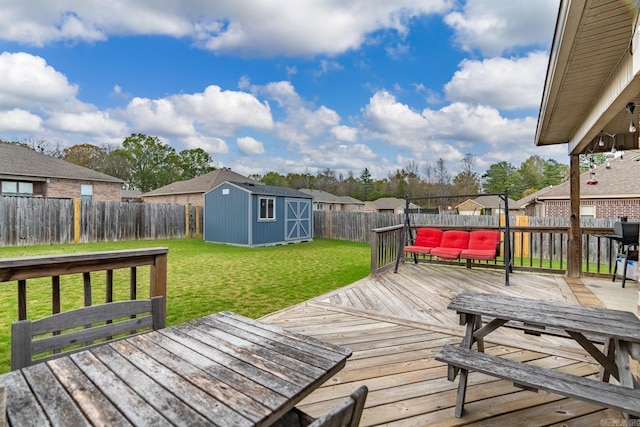 deck featuring a yard and a shed