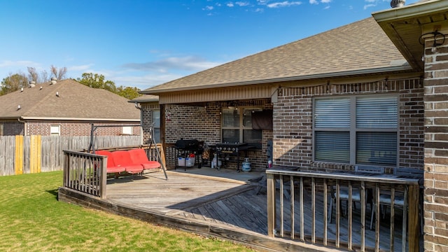 wooden deck with a yard