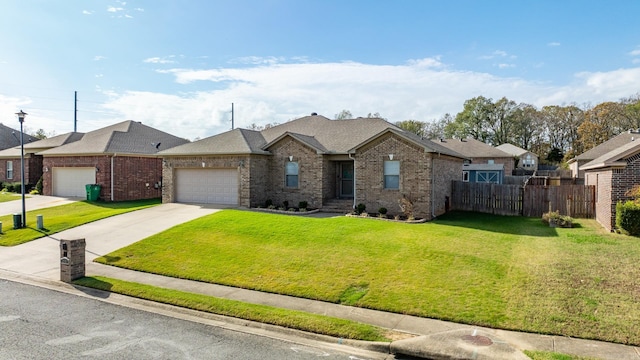 ranch-style house featuring a garage and a front lawn