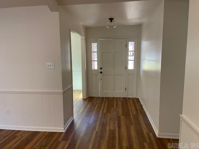 entrance foyer with dark hardwood / wood-style floors