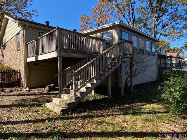 back of property with a wooden deck