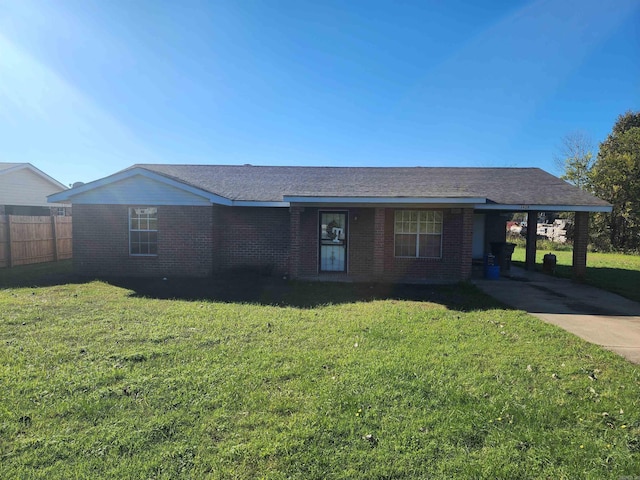 ranch-style home with a front lawn and a carport