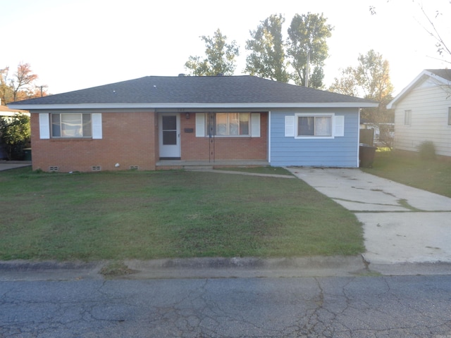 ranch-style house with a front lawn