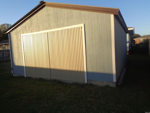 view of side of home featuring an outdoor structure