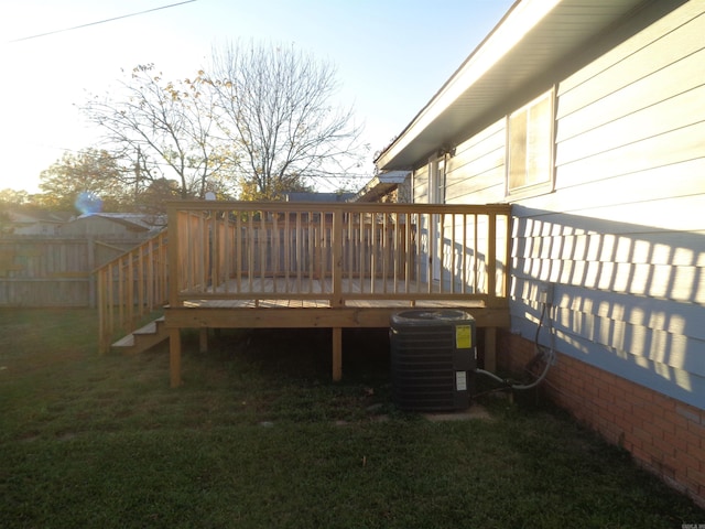 deck with a lawn and central AC