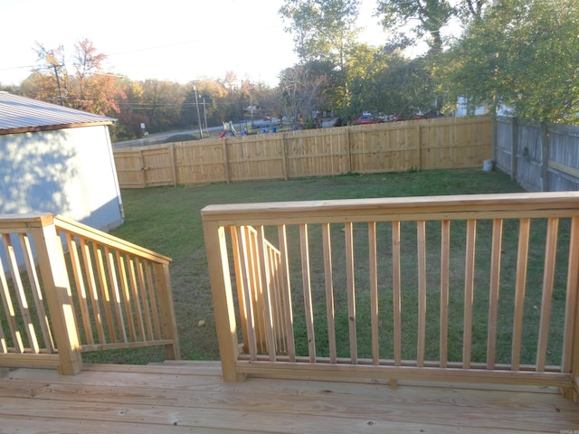 wooden deck featuring a yard