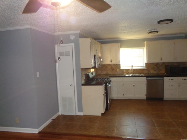 kitchen with white cabinetry, decorative backsplash, sink, and stainless steel appliances