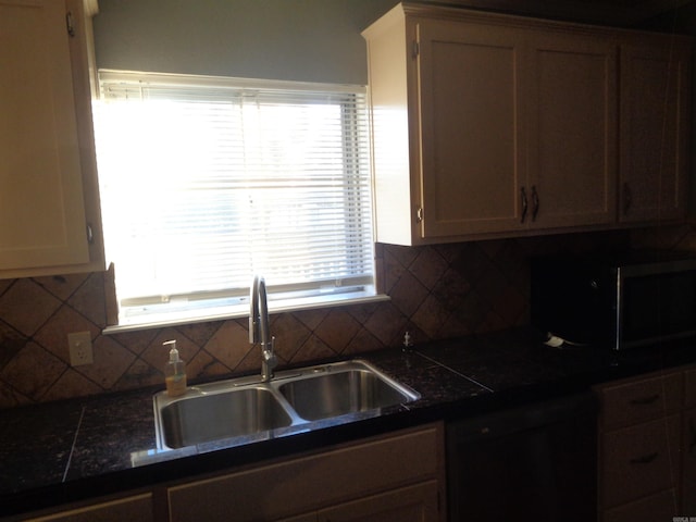 kitchen with decorative backsplash, sink, and black dishwasher