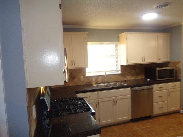 kitchen featuring white cabinets and appliances with stainless steel finishes