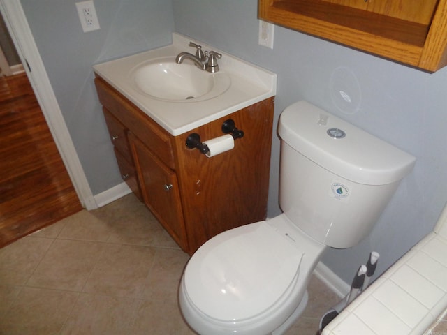 bathroom with tile patterned floors, vanity, and toilet