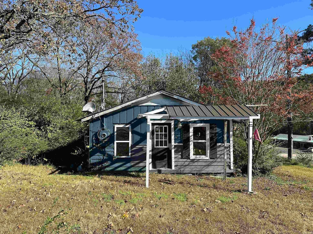 view of outdoor structure with a lawn