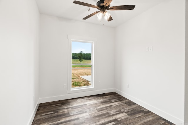 empty room featuring ceiling fan and dark hardwood / wood-style flooring