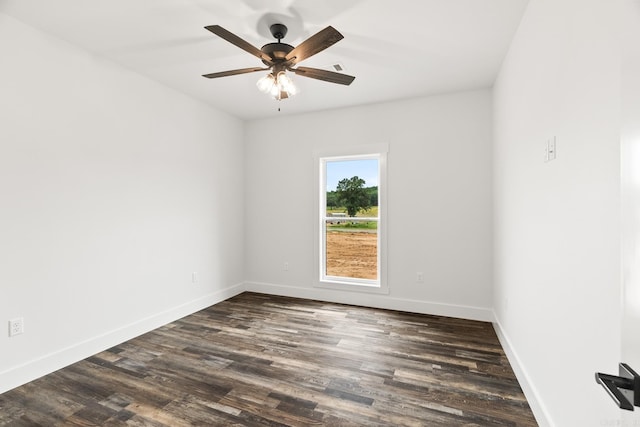 unfurnished room with ceiling fan and dark wood-type flooring