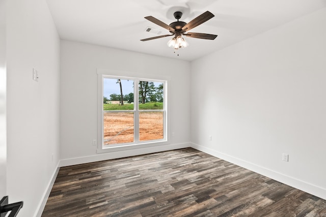 empty room featuring dark hardwood / wood-style floors and ceiling fan