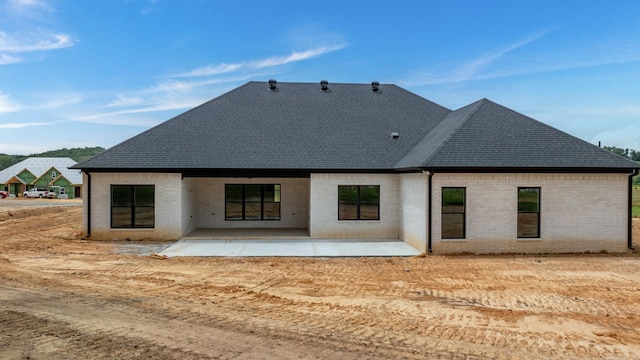 back of property featuring a patio area