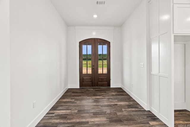 foyer entrance featuring french doors and dark wood-type flooring