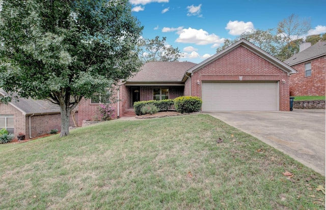 view of front of property featuring a front yard and a garage