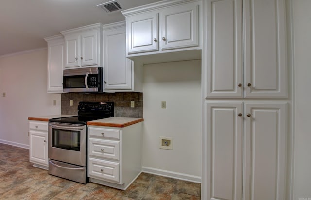 kitchen with stainless steel appliances, white cabinetry, tasteful backsplash, and ornamental molding