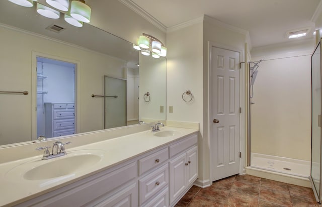 bathroom with tile patterned flooring, vanity, ornamental molding, and a shower with door