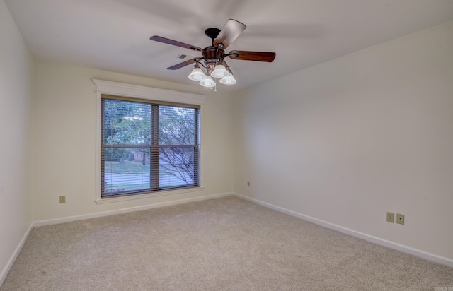 carpeted empty room with ceiling fan