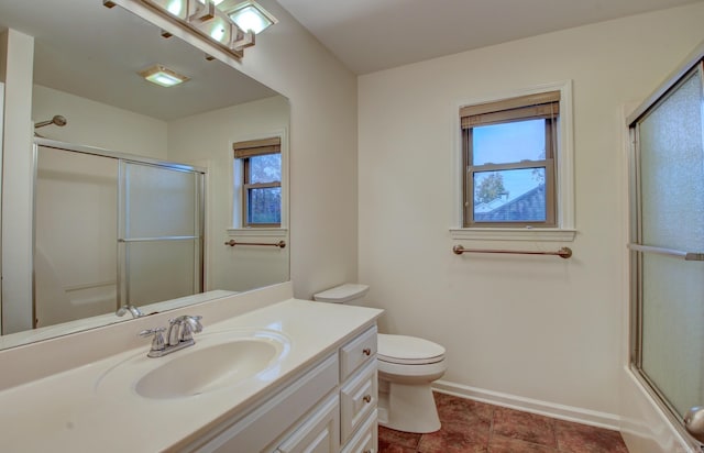 full bathroom with vanity, toilet, and bath / shower combo with glass door