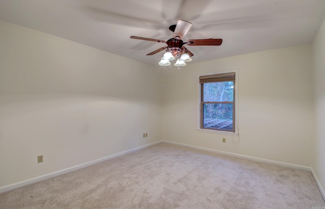 unfurnished room featuring light colored carpet and ceiling fan