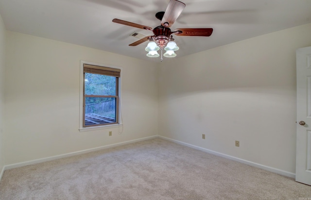 empty room featuring light carpet and ceiling fan