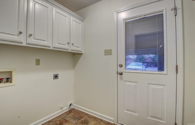 washroom featuring electric dryer hookup, hookup for a washing machine, and cabinets