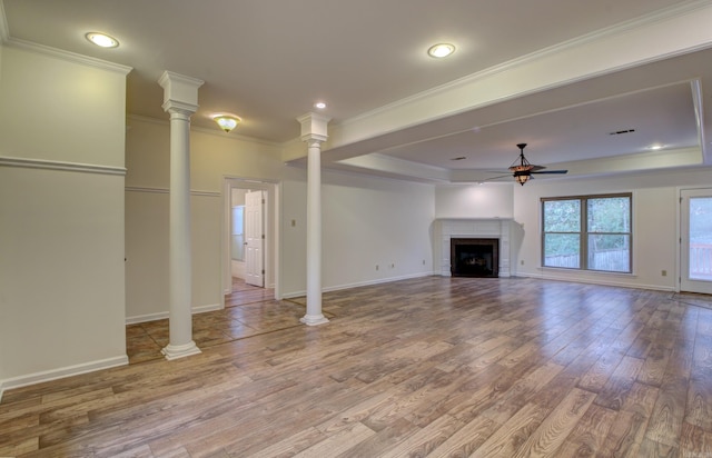 unfurnished living room featuring crown molding, ceiling fan, and wood-type flooring