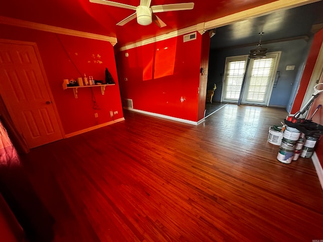 interior space featuring dark hardwood / wood-style flooring, ceiling fan, and ornamental molding