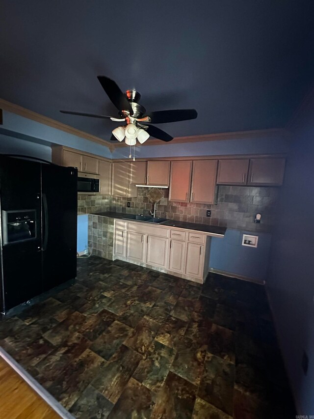 kitchen with backsplash, black refrigerator with ice dispenser, ceiling fan, crown molding, and sink