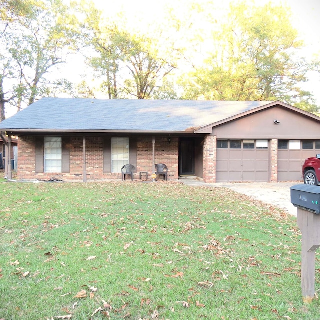 ranch-style house with a front yard and a garage