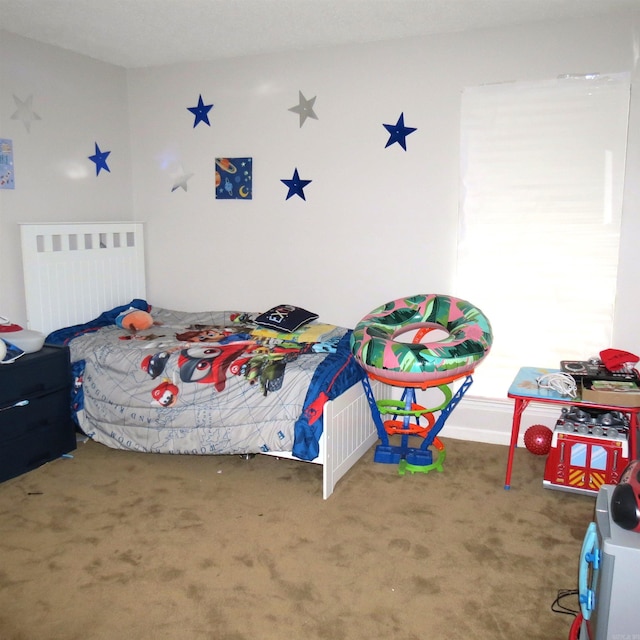 bedroom featuring carpet