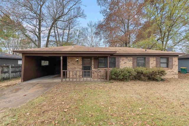 view of front of house featuring a front lawn and a carport