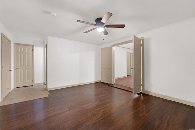 spare room with ceiling fan and wood-type flooring