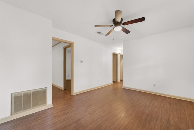 spare room with hardwood / wood-style flooring and ceiling fan