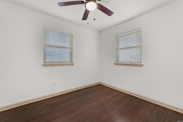 empty room with ceiling fan and hardwood / wood-style flooring