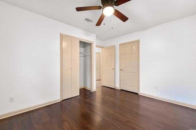 unfurnished bedroom with dark hardwood / wood-style floors and ceiling fan