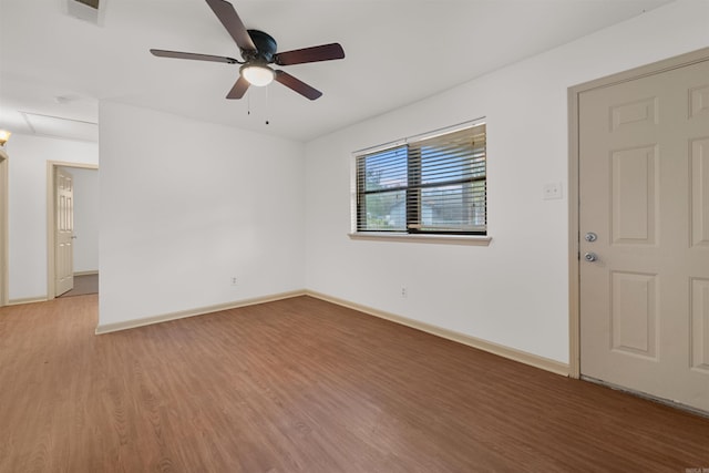 empty room featuring hardwood / wood-style flooring and ceiling fan