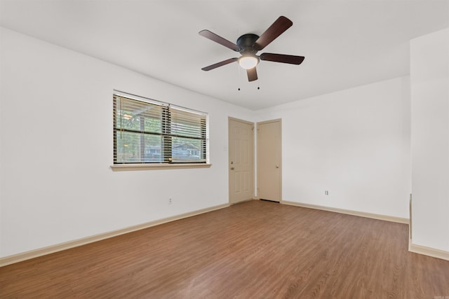 unfurnished room with ceiling fan and hardwood / wood-style floors