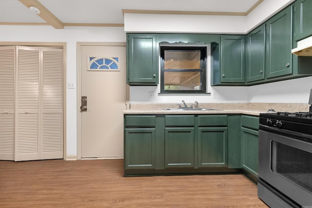 kitchen featuring gas stove, sink, light hardwood / wood-style flooring, and green cabinetry