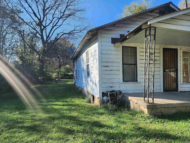 2920 Scott St, Little Rock, AR 72206 - view of side of home featuring a lawn