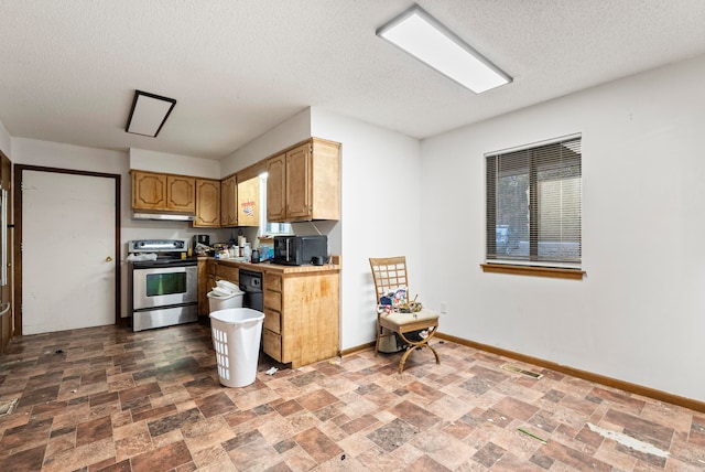 kitchen featuring stainless steel electric stove and a textured ceiling