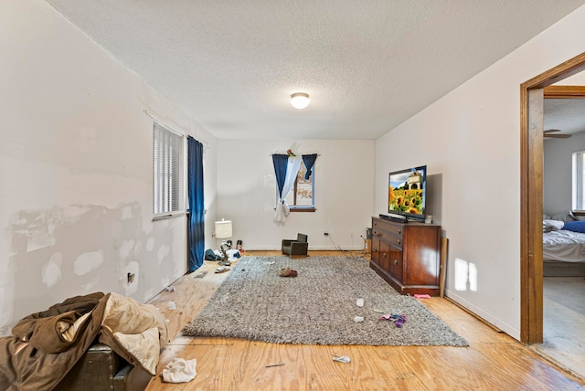 interior space featuring hardwood / wood-style flooring and a textured ceiling