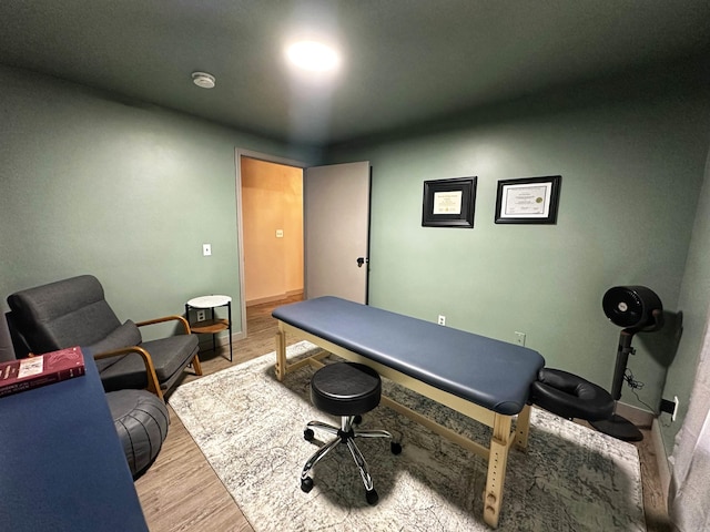 office space with wood-type flooring