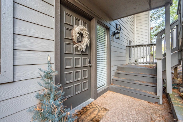 property entrance featuring a porch