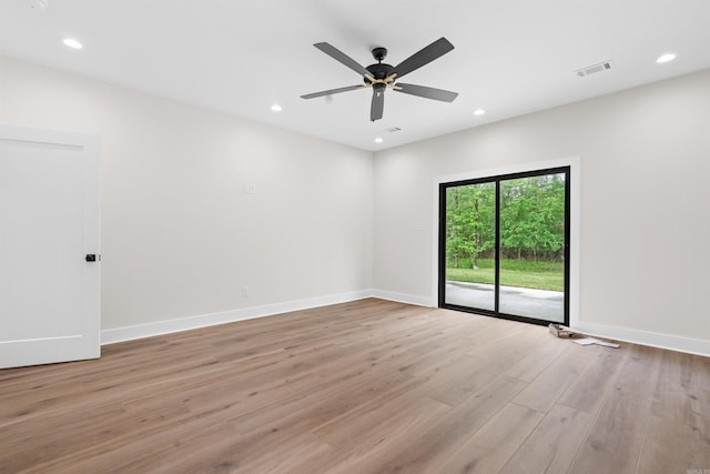 unfurnished room with light wood-type flooring and ceiling fan