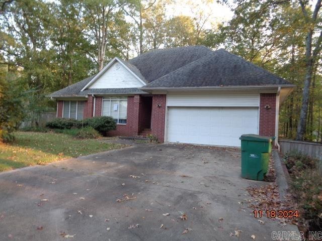 ranch-style house featuring a garage